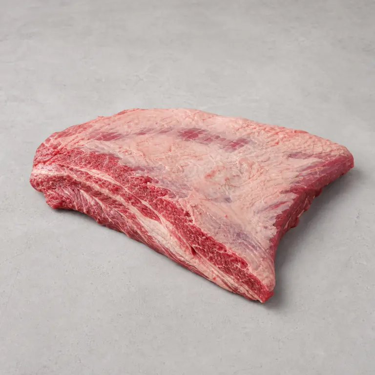 Beef brisket (raw) on a neutral surface