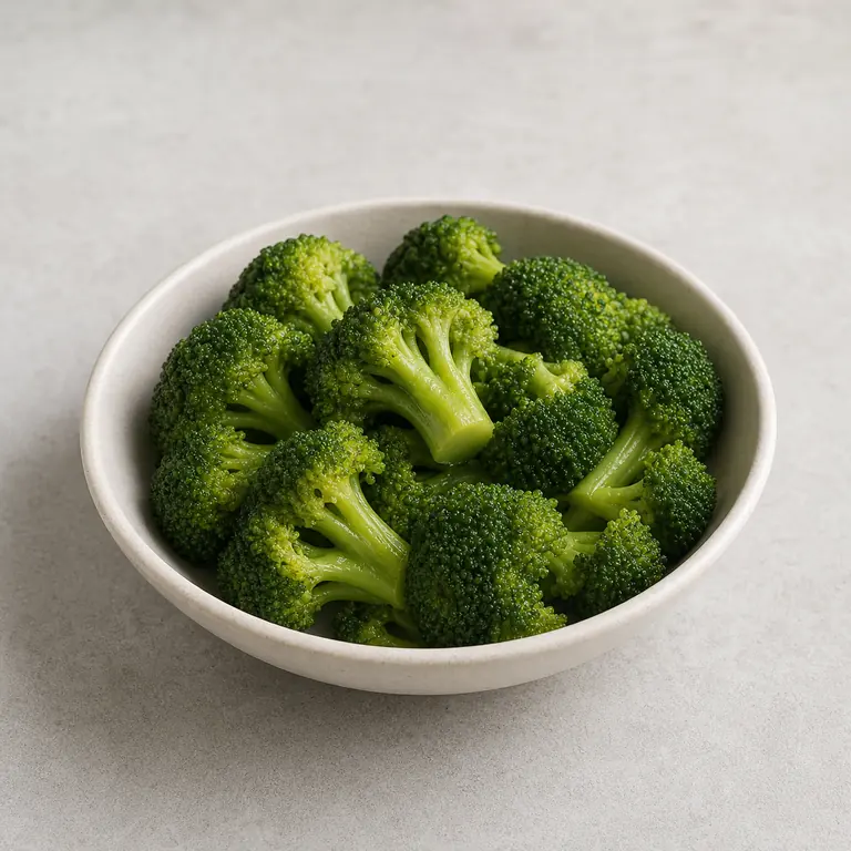 Broccoli (cooked) on a neutral surface