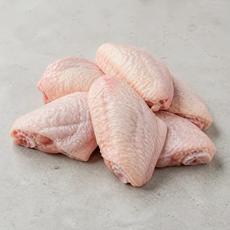 Chicken wings (raw) on a neutral surface