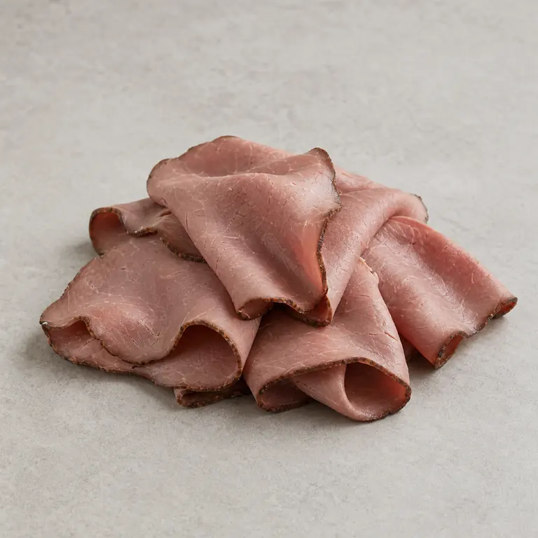 Deli roast beef on a neutral surface