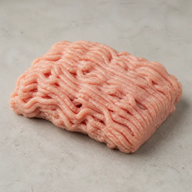 Ground turkey (raw) on a neutral surface
