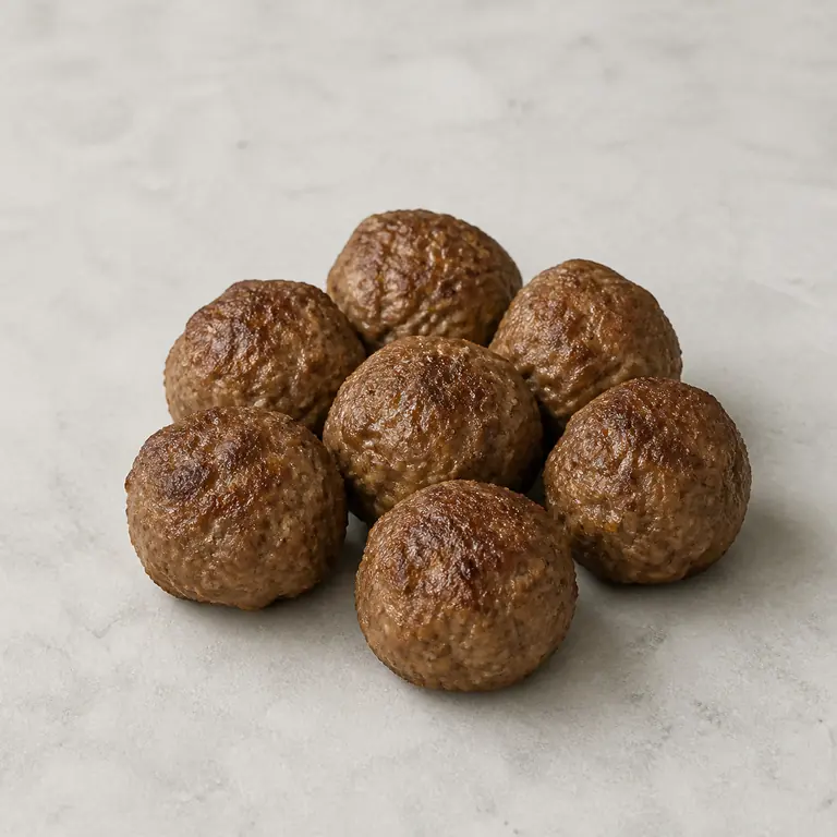 Meatballs (cooked) on a neutral surface