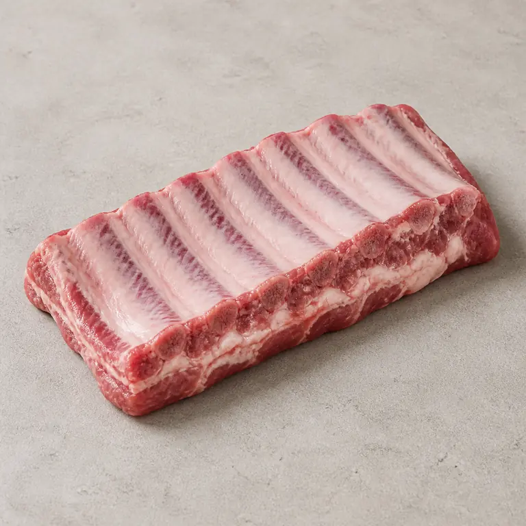 Pork ribs (raw) on a neutral surface