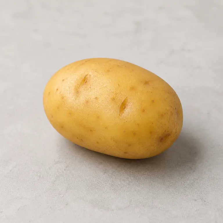 Potato (raw) on a neutral surface