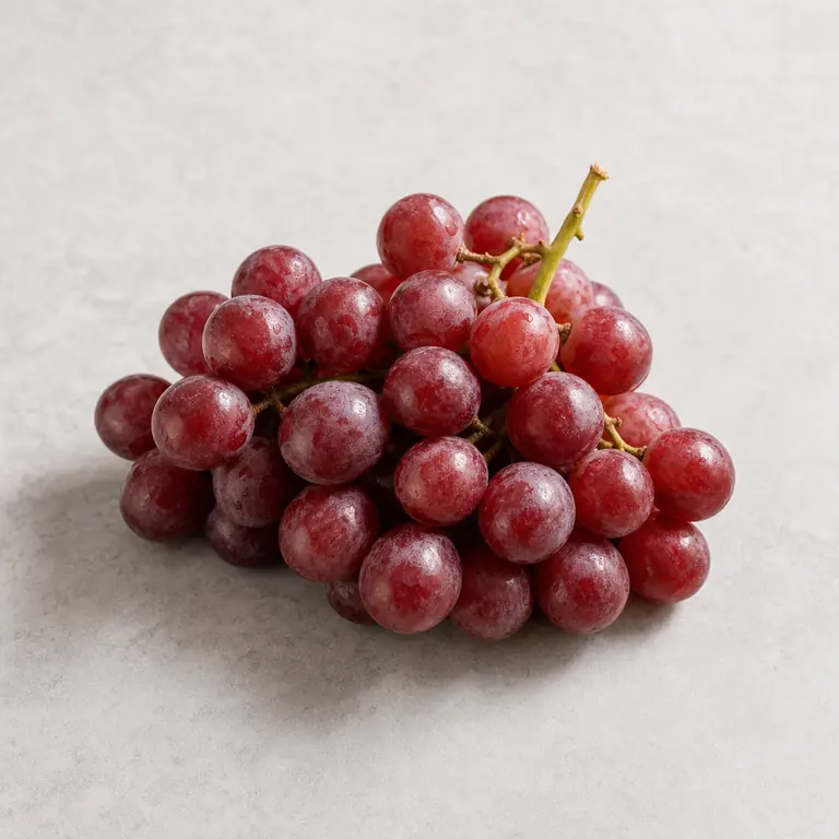 Red grapes on a neutral surface