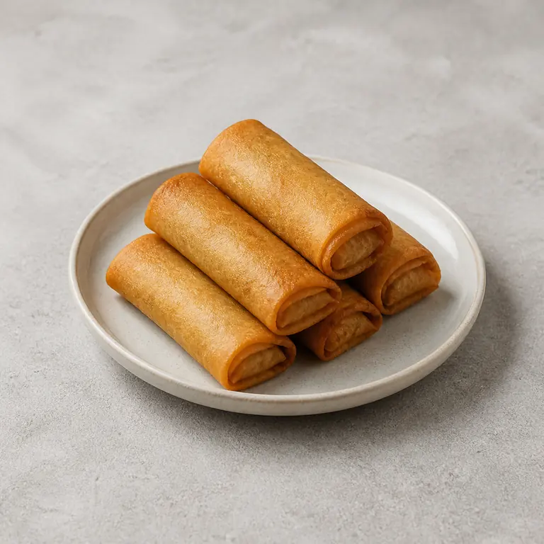 Spring rolls (cooked) on a neutral surface