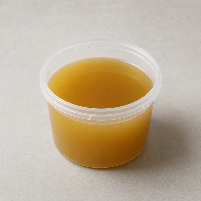 Vegetable broth (opened) on a neutral surface