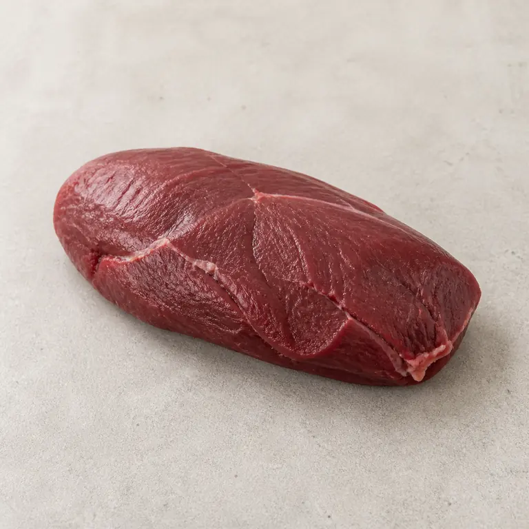Venison (raw) on a neutral surface