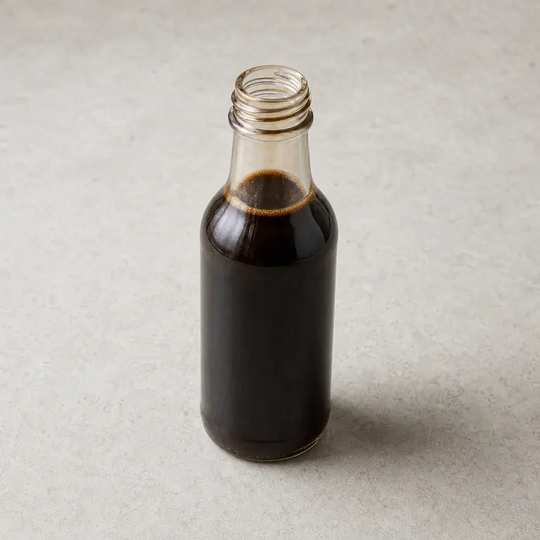 Worcestershire sauce (opened) on a neutral surface